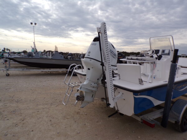 2023 Blue Wave 1900 STL fishing boat with outboard motor on trailer.